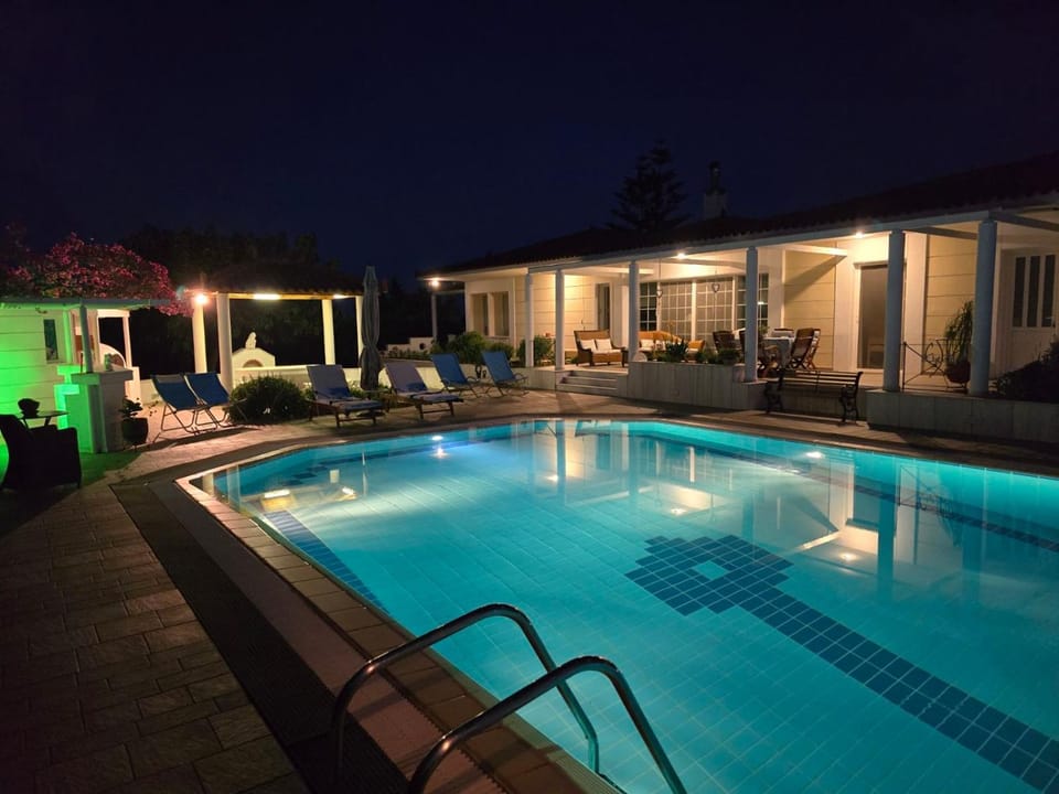Property building, Night, Pool view, Swimming pool, Swimming pool, sunbed