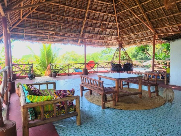 View (from property/room), Balcony/Terrace, Decorative detail, Seating area, Garden view