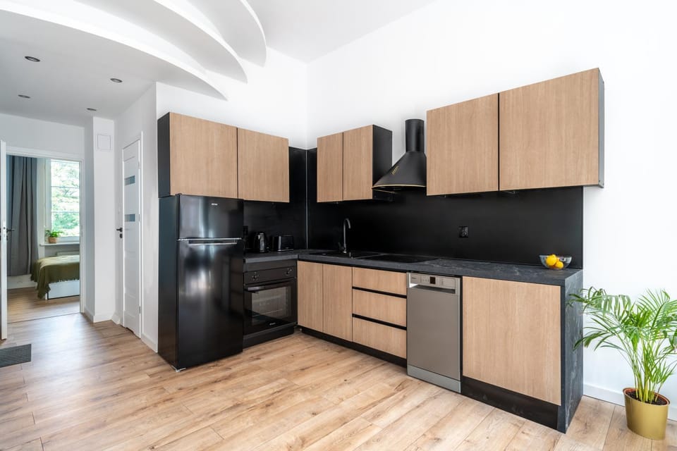 Kitchen or kitchenette, dishwasher, oven, stove