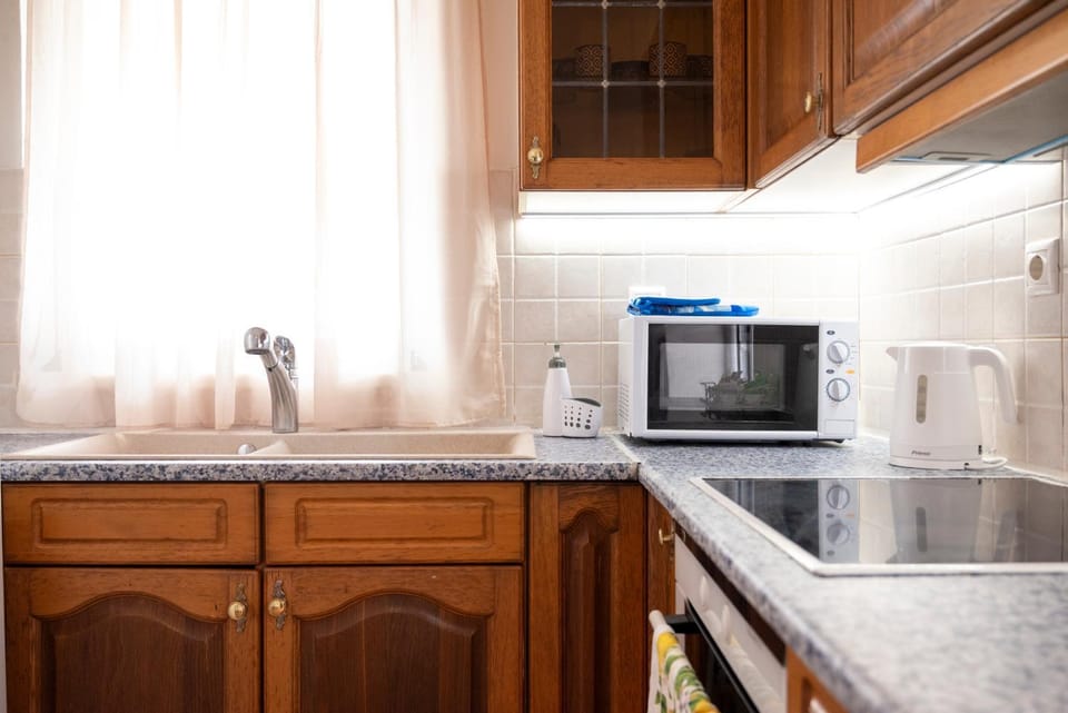 Kitchen or kitchenette, oven, stove