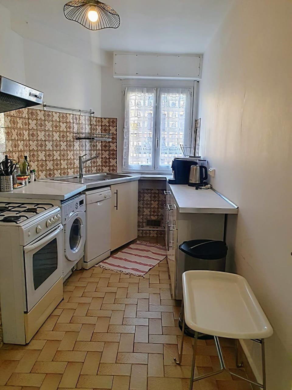 Kitchen or kitchenette, dishwasher, oven, stove, washing machine