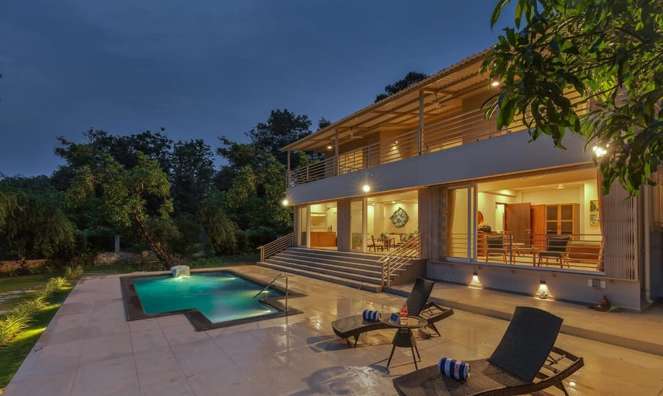 Property building, Patio, Night, Natural landscape, Garden, Garden view, Pool view, Swimming pool, sunbed