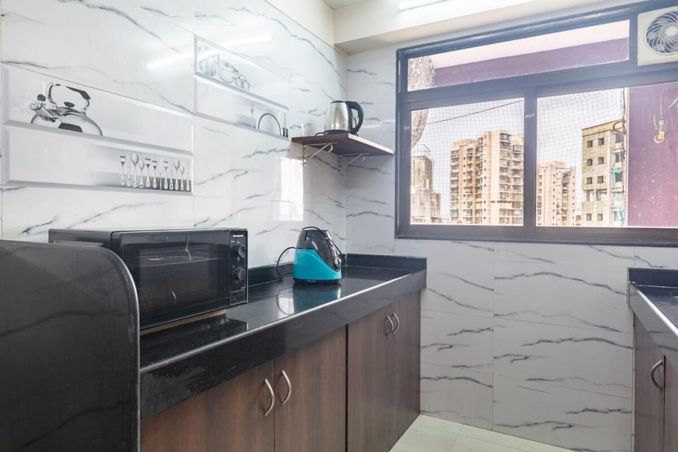 Kitchen or kitchenette, stove, toaster