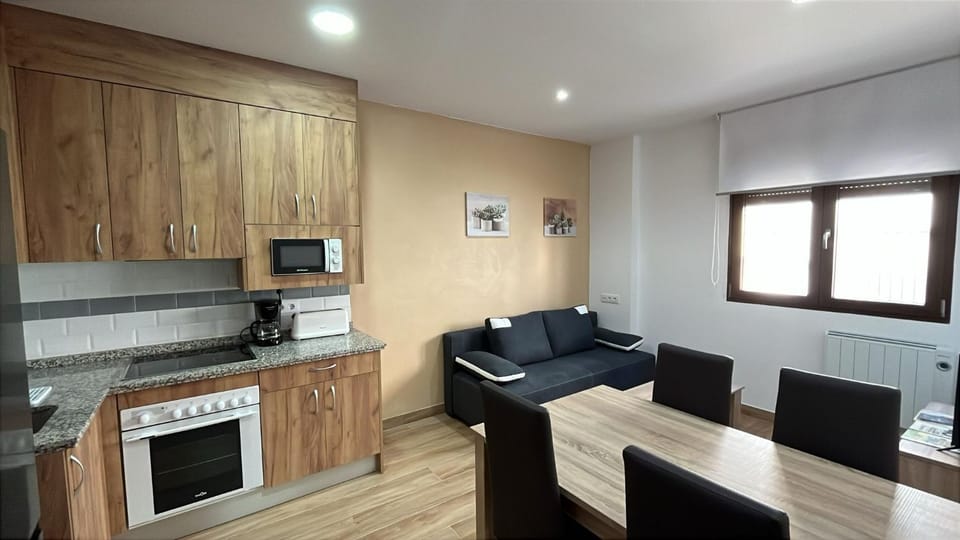 Living room, Seating area, Dining area, oven, stove, toaster