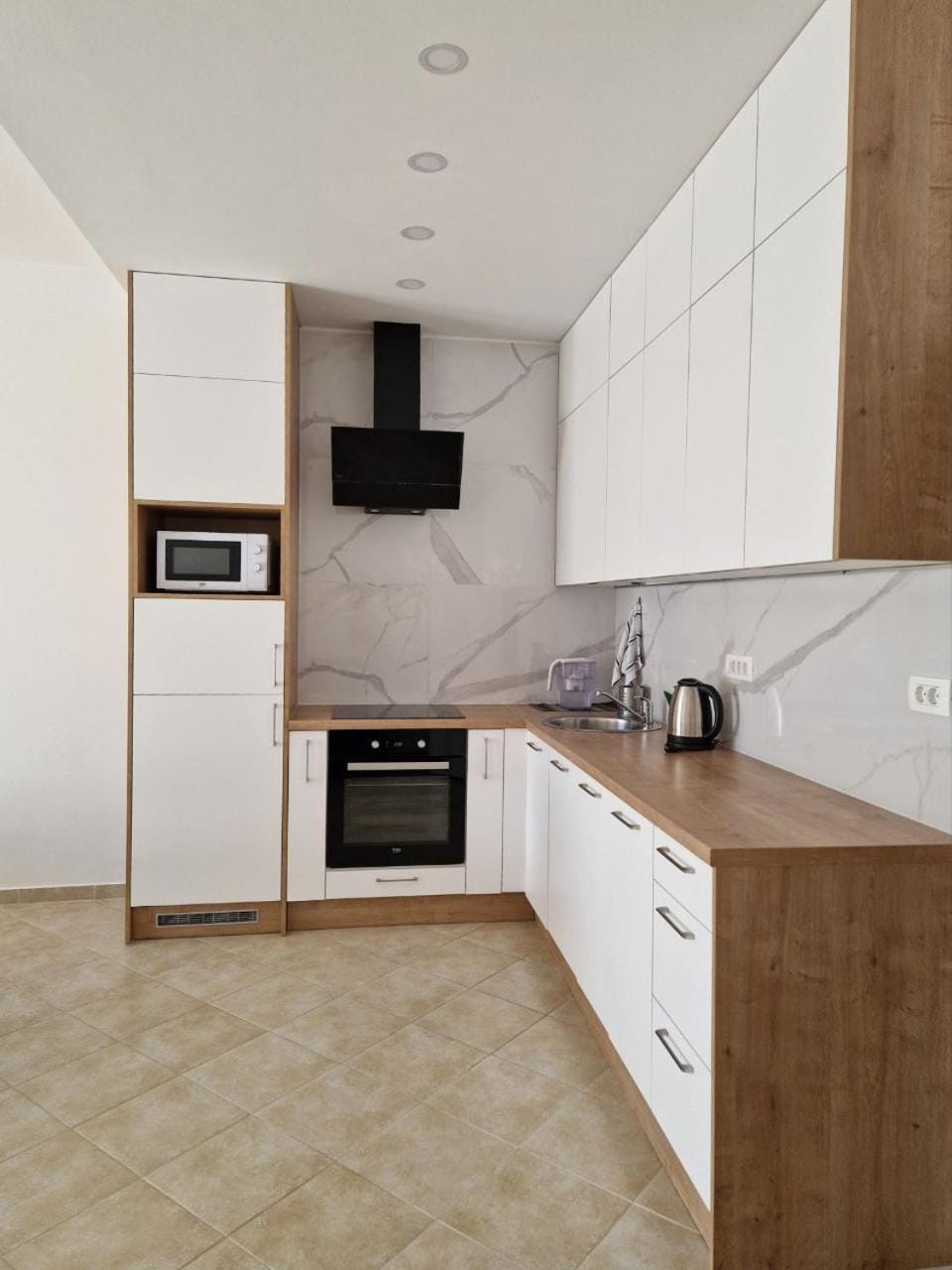 Kitchen or kitchenette, dishwasher, oven, stove