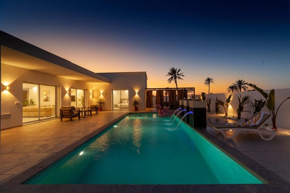 Property building, Night, Natural landscape, Pool view, Swimming pool, sunbed