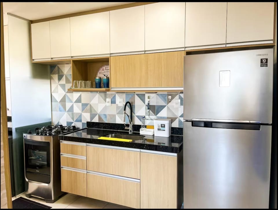 Kitchen or kitchenette, microwave, oven, stove