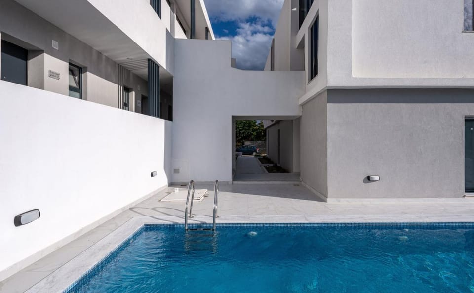 Property building, Patio, Day, Pool view, Swimming pool