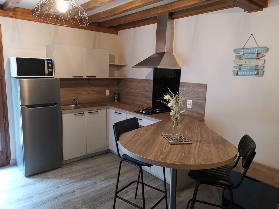Kitchen or kitchenette, dishwasher, oven, stove