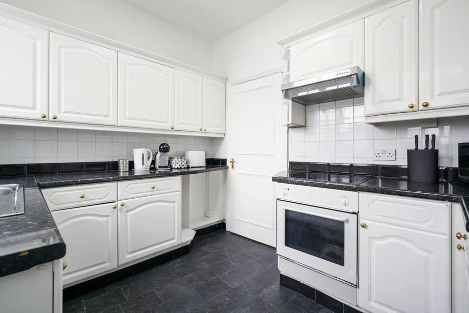 Kitchen or kitchenette, oven, stove, toaster