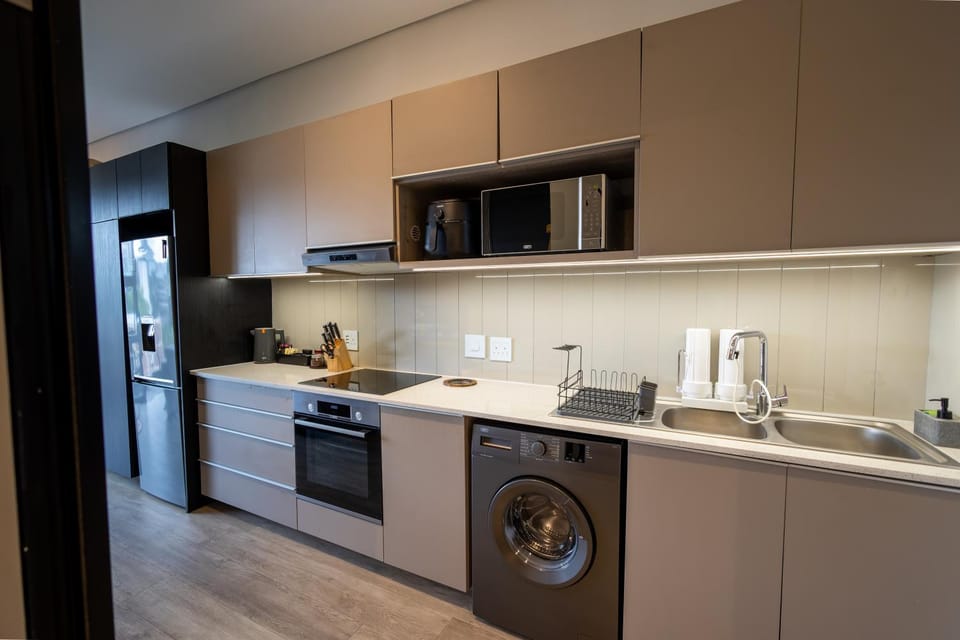 Coffee/tea facilities, Kitchen or kitchenette, oven, stove, toaster, washing machine