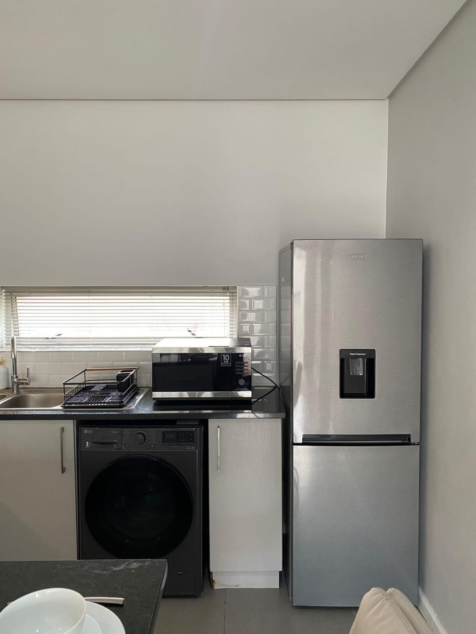 Kitchen or kitchenette, washing machine