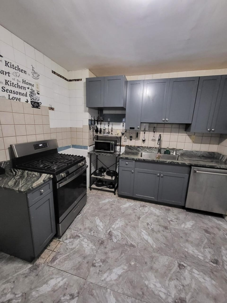 Kitchen or kitchenette, dishwasher, microwave, oven, stove