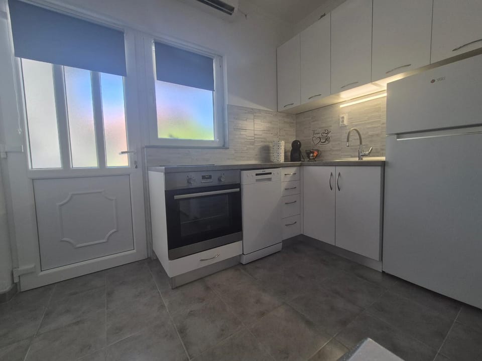 Kitchen or kitchenette, dishwasher, oven, stove, toaster
