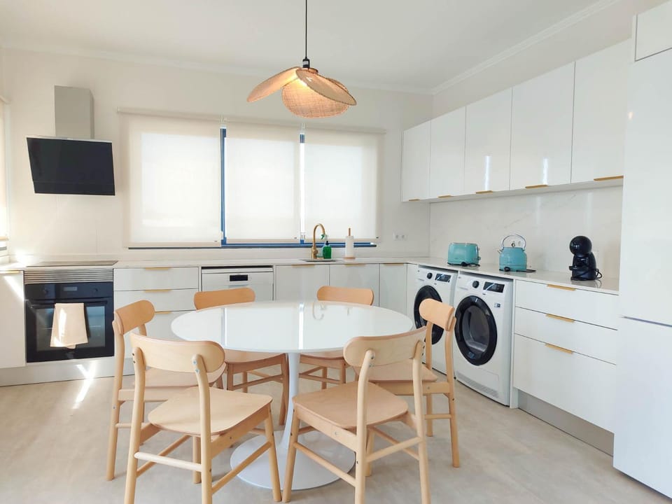 Kitchen or kitchenette, Dining area, dishwasher, oven, stove, toaster, washing machine, dryer