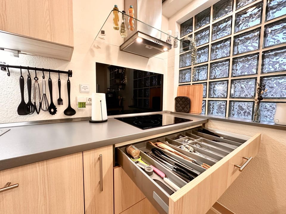 Kitchen or kitchenette, dishwasher, oven, stove