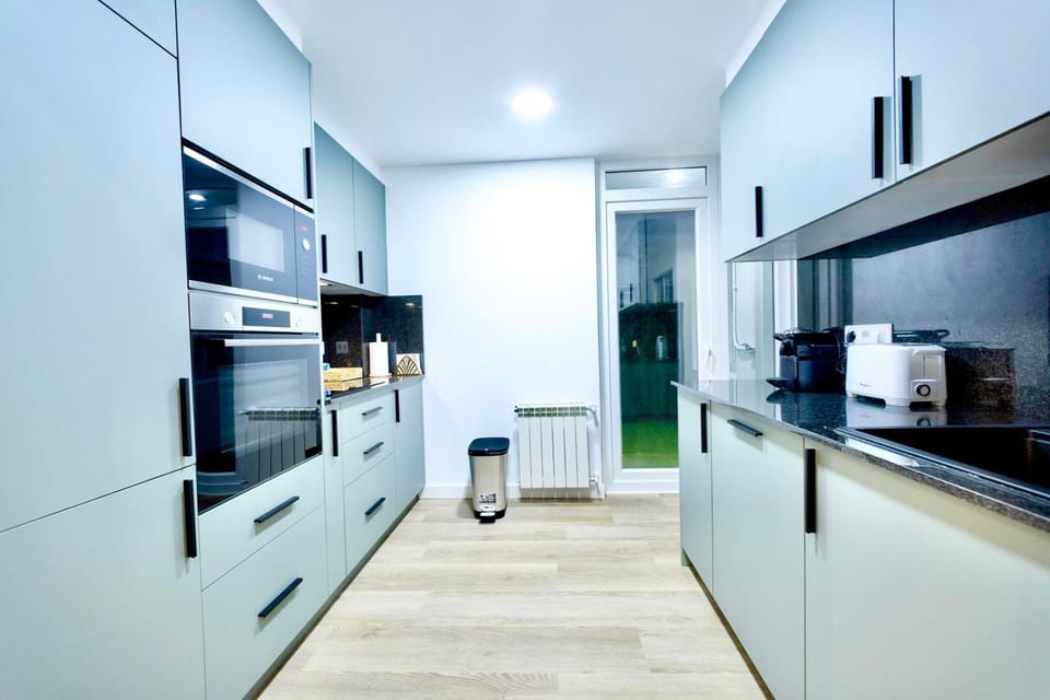 Kitchen or kitchenette, dishwasher, oven, stove, toaster