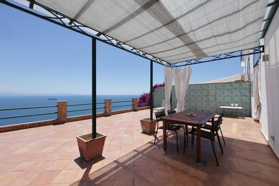 Property building, Patio, Day, Natural landscape, View (from property/room), Balcony/Terrace, Dining area, Sea view