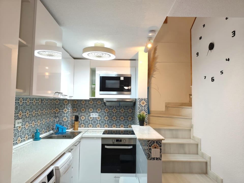 Photo of the whole room, microwave, oven, stove, kitchen