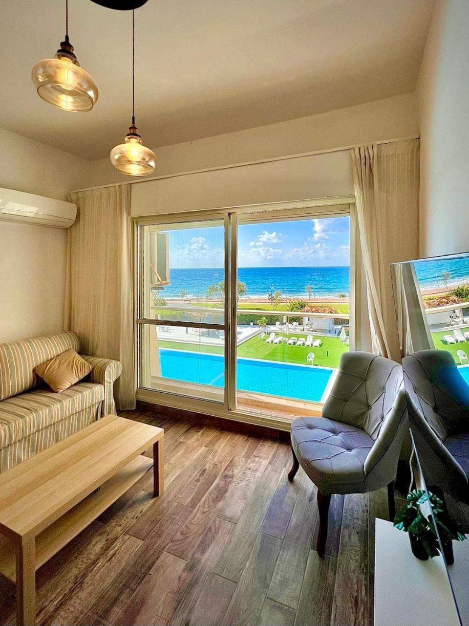 TV and multimedia, Living room, Seating area, Pool view, Sea view, Swimming pool