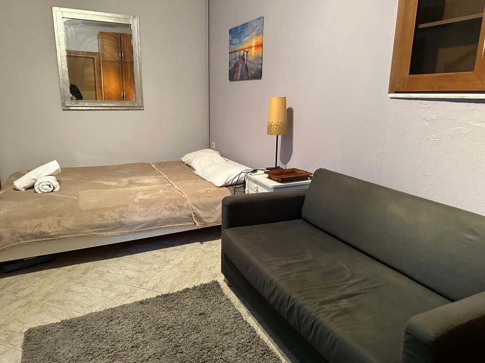 Bed, Living room, Seating area, Bedroom