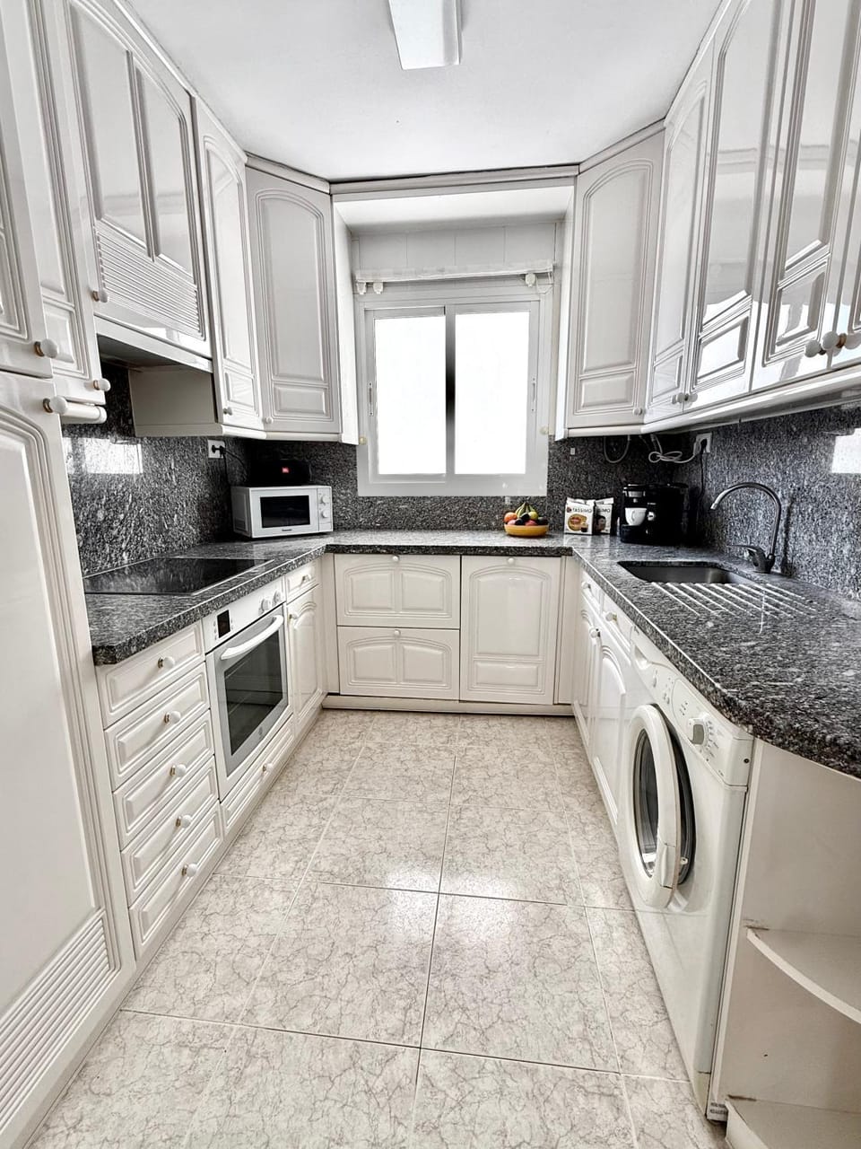 Kitchen or kitchenette, dishwasher, oven, stove, toaster