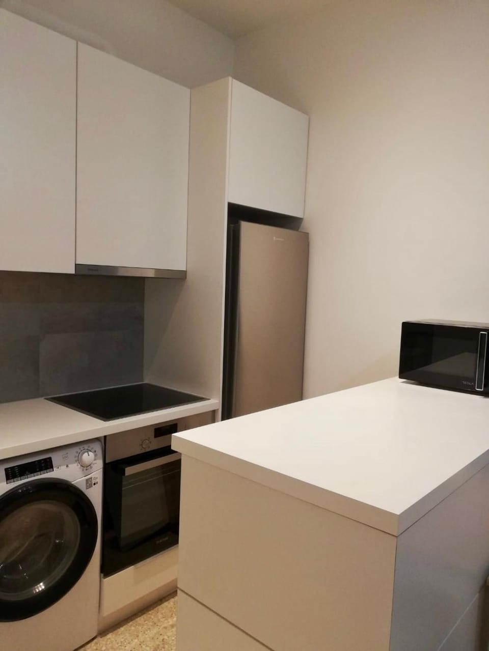 Kitchen or kitchenette, oven, stove, washing machine, dryer