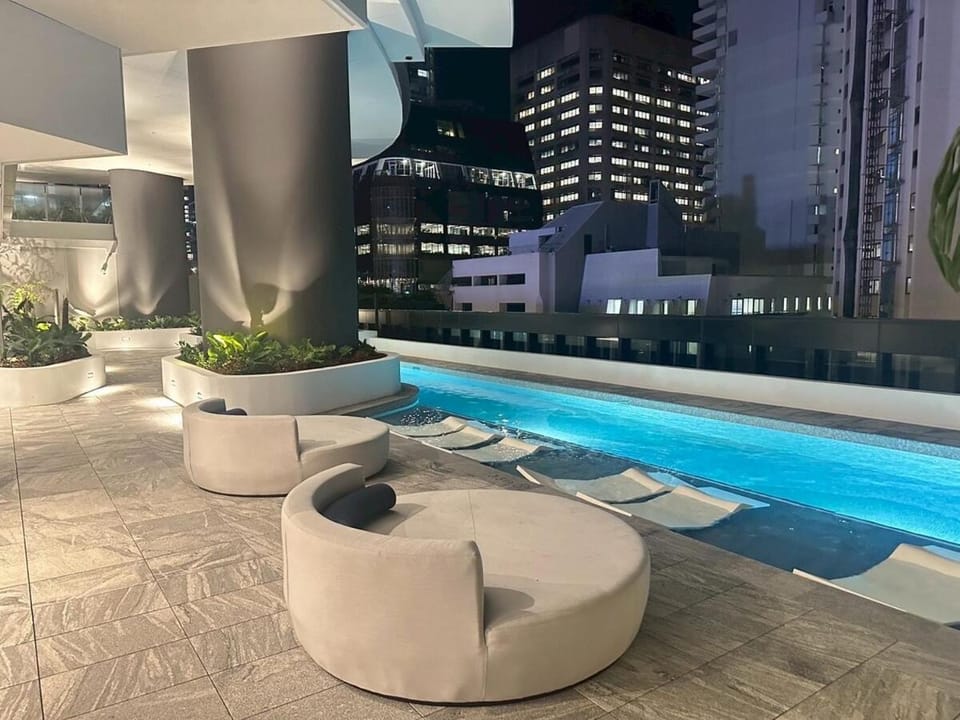 Property building, Patio, Night, Pool view, Swimming pool, sunbed