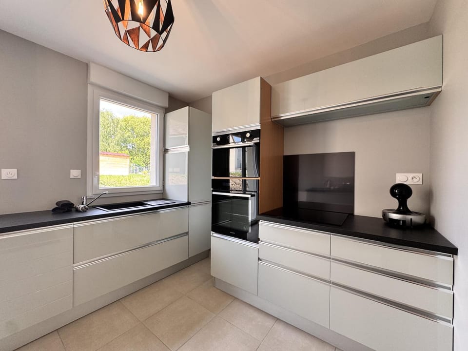 Kitchen or kitchenette, dishwasher, oven, stove
