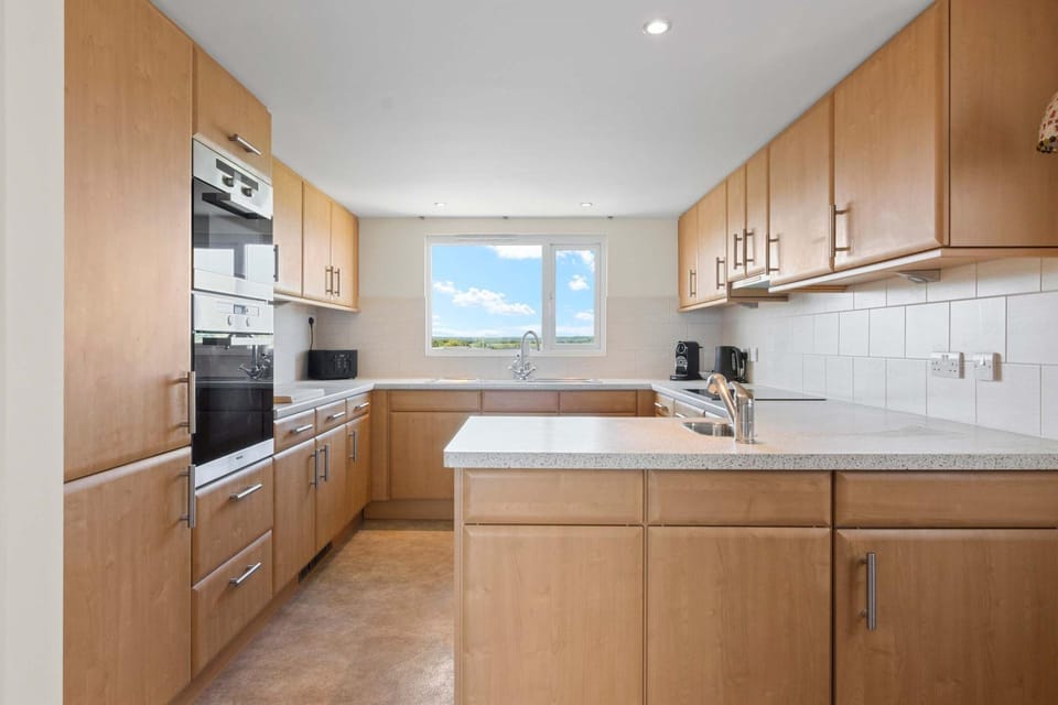 Kitchen or kitchenette, dishwasher, oven, stove