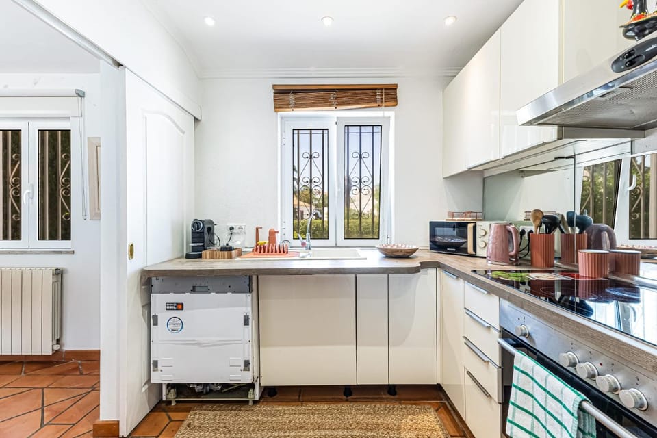Kitchen or kitchenette, dishwasher, oven, stove