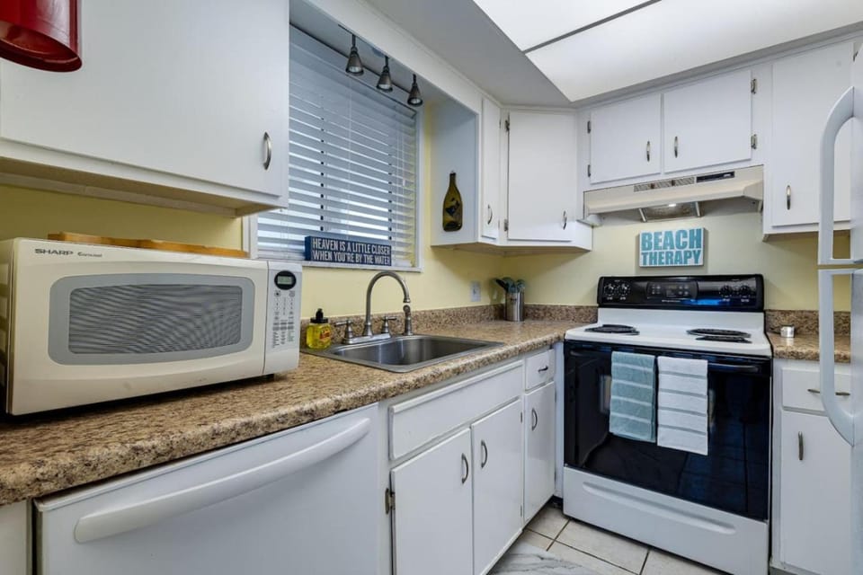 Kitchen or kitchenette, dishwasher, oven, stove, toaster