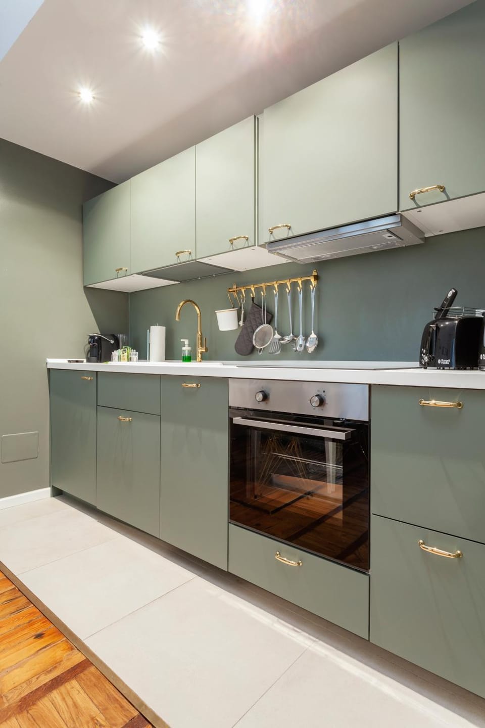 Kitchen or kitchenette, dishwasher, oven, stove