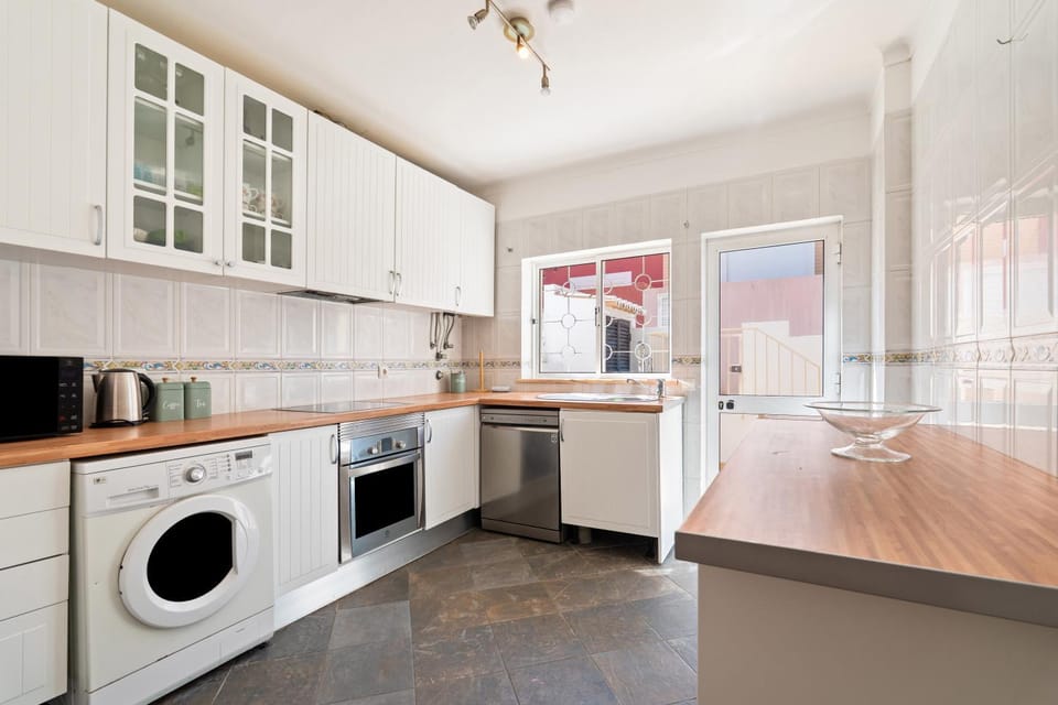 Kitchen or kitchenette, dishwasher, oven, stove, washing machine