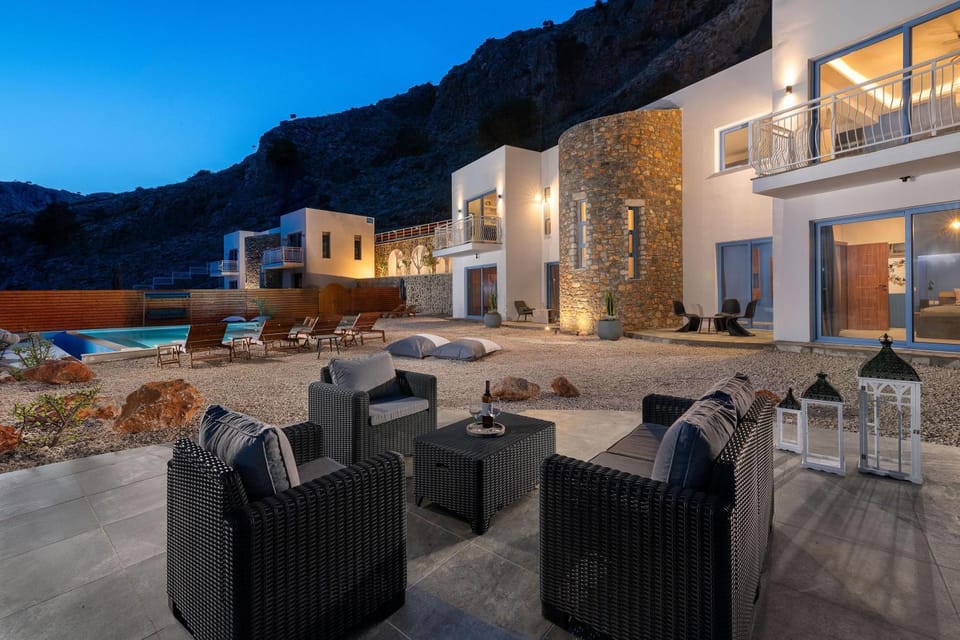 Property building, Patio, Night, Natural landscape, Seating area, Mountain view, Pool view, Swimming pool