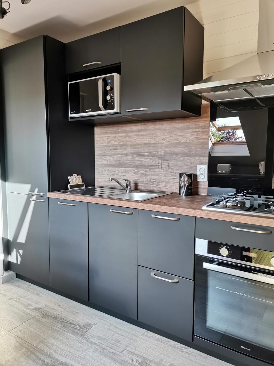 Kitchen or kitchenette, dishwasher, oven, stove
