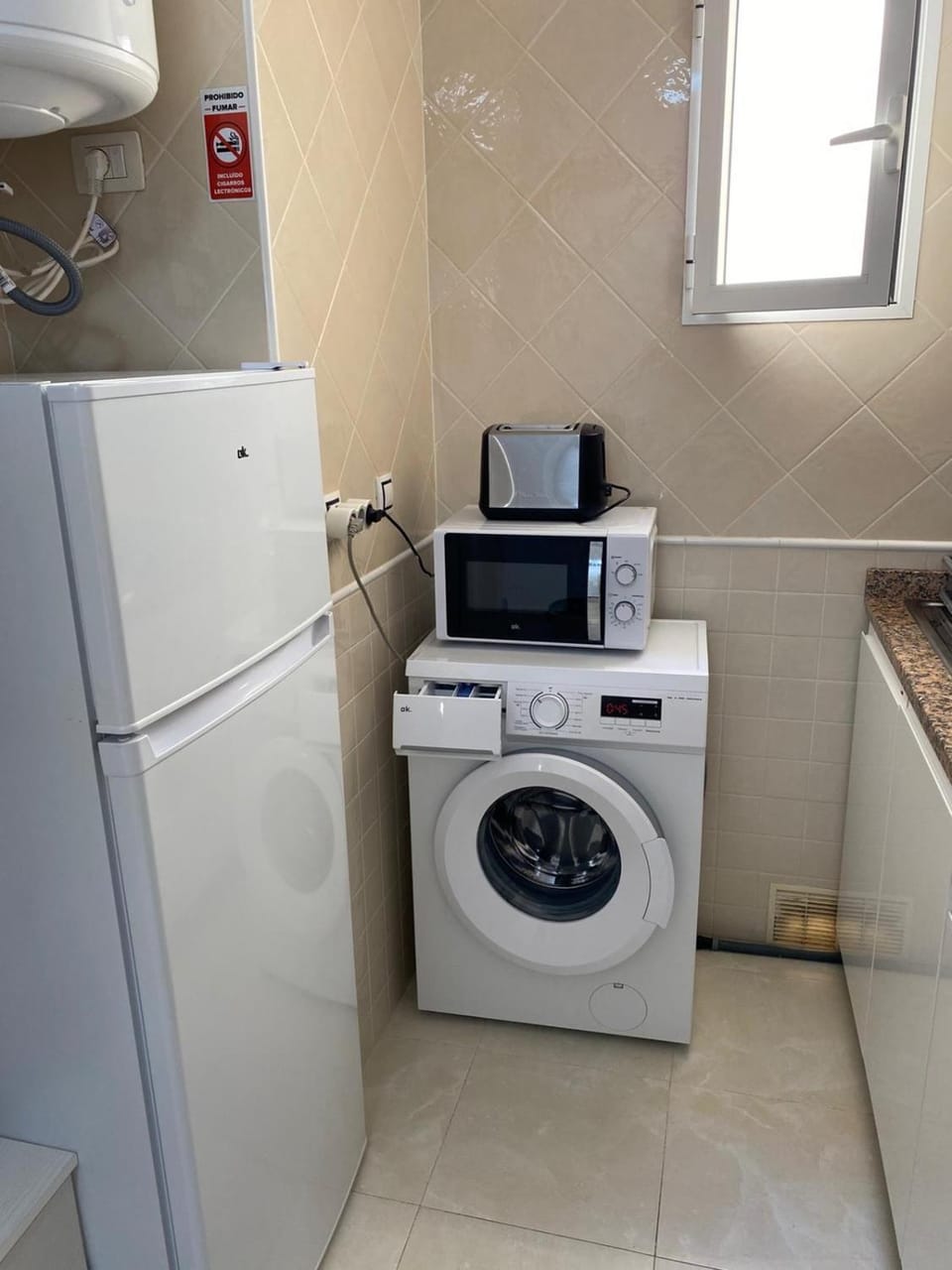 Kitchen or kitchenette, washing machine