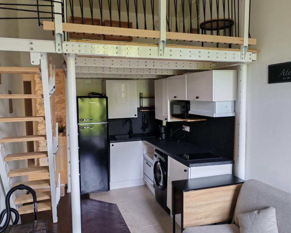 Kitchen or kitchenette, dishwasher, oven, stove, toaster, washing machine, dryer