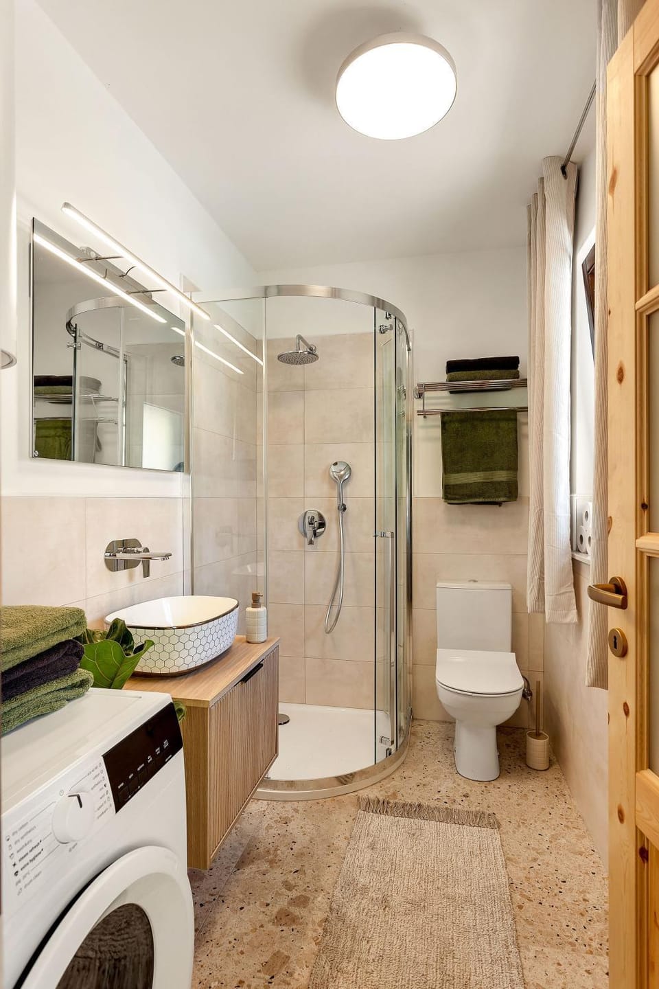Shower, Toilet, towels, washing machine, dryer