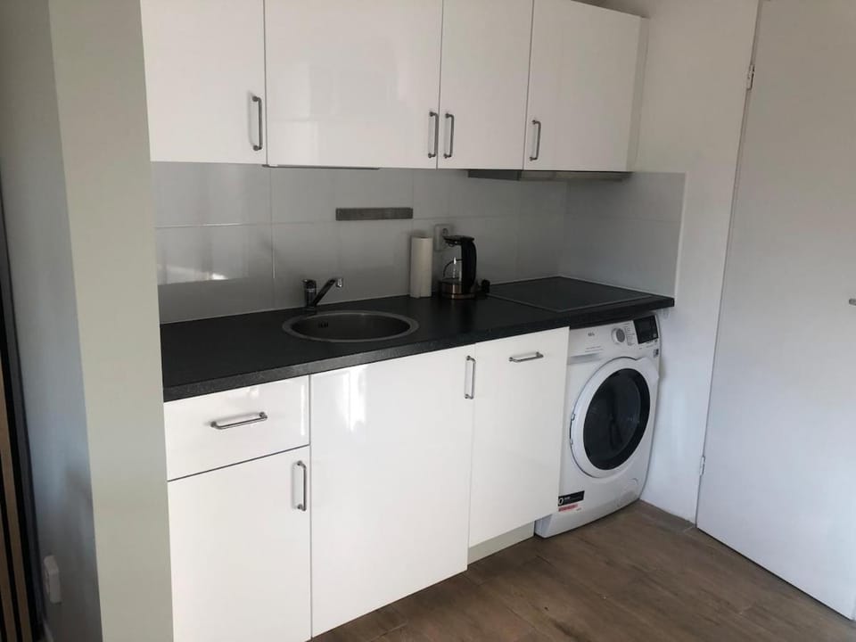 Kitchen or kitchenette, dishwasher, stove, washing machine