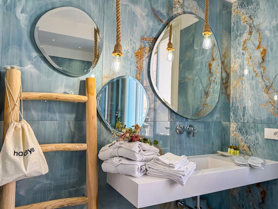 Bathroom, hair dryier, towels, towels, air conditioner, air conditioner