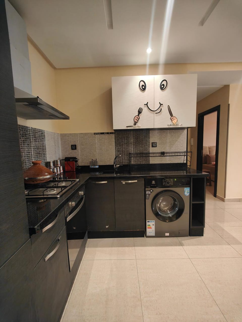 Kitchen or kitchenette, washing machine