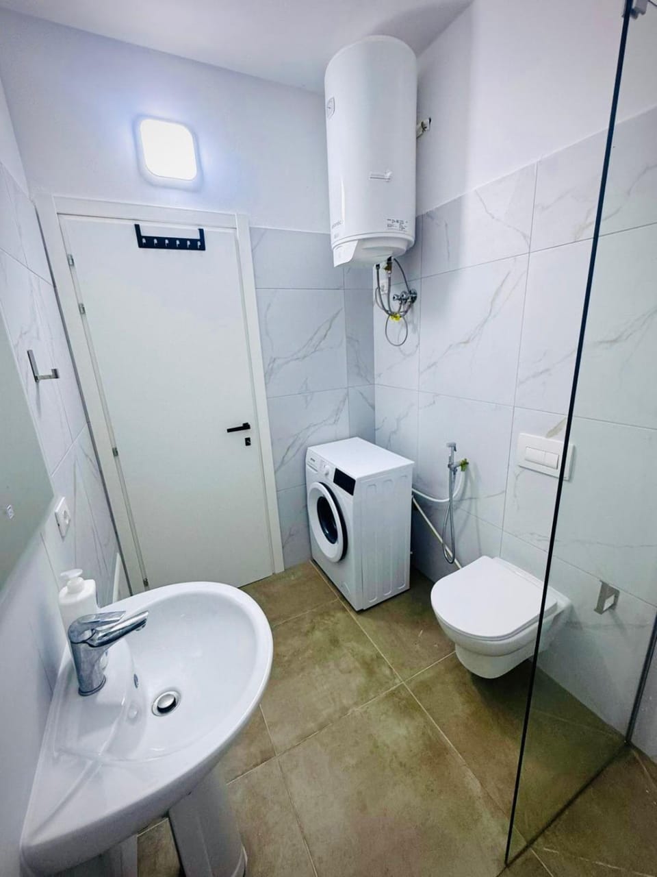 Shower, Bathroom, bidet, towels, washing machine, dryer
