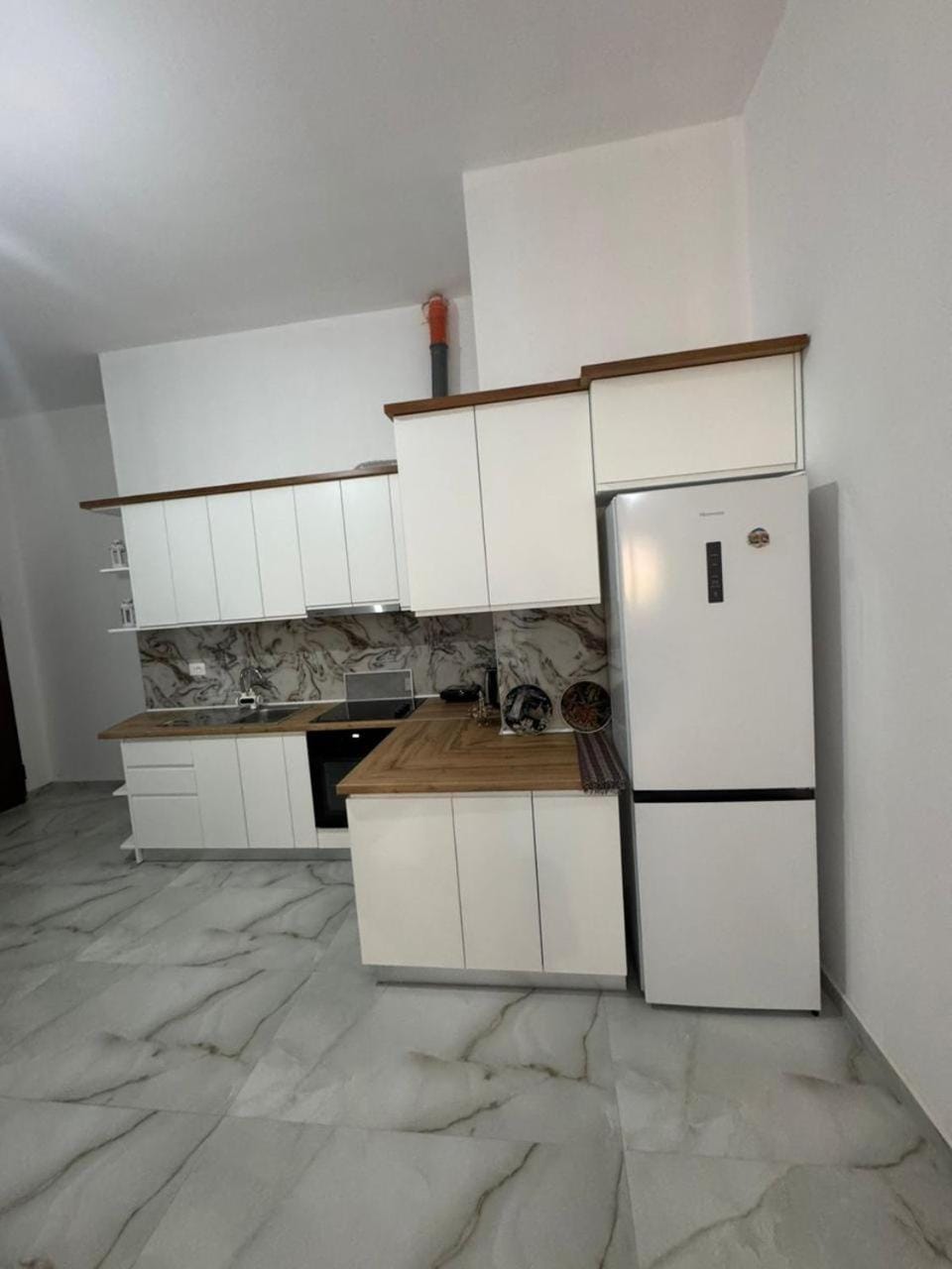 Kitchen or kitchenette, dishwasher, oven, stove
