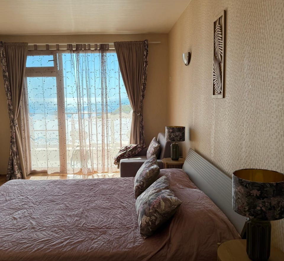 Bed, Seating area, Bedroom, Sea view