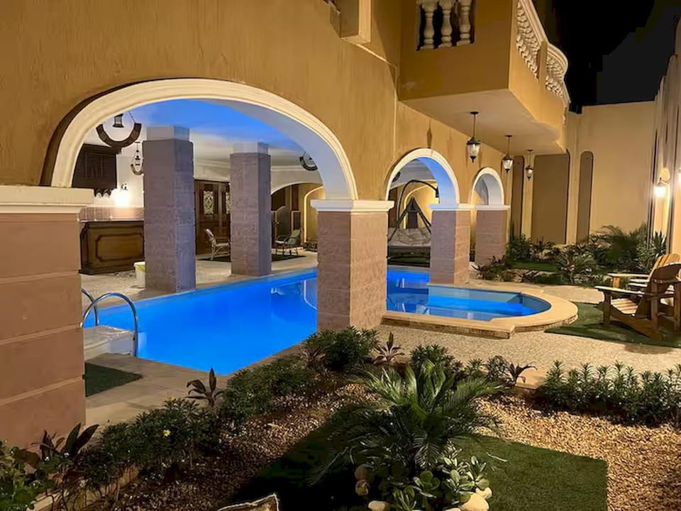 Property building, Patio, Night, Garden, Garden view, Pool view, Swimming pool, sunbed