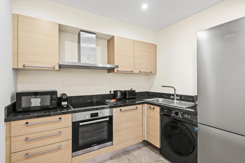 Kitchen or kitchenette, stove, washing machine