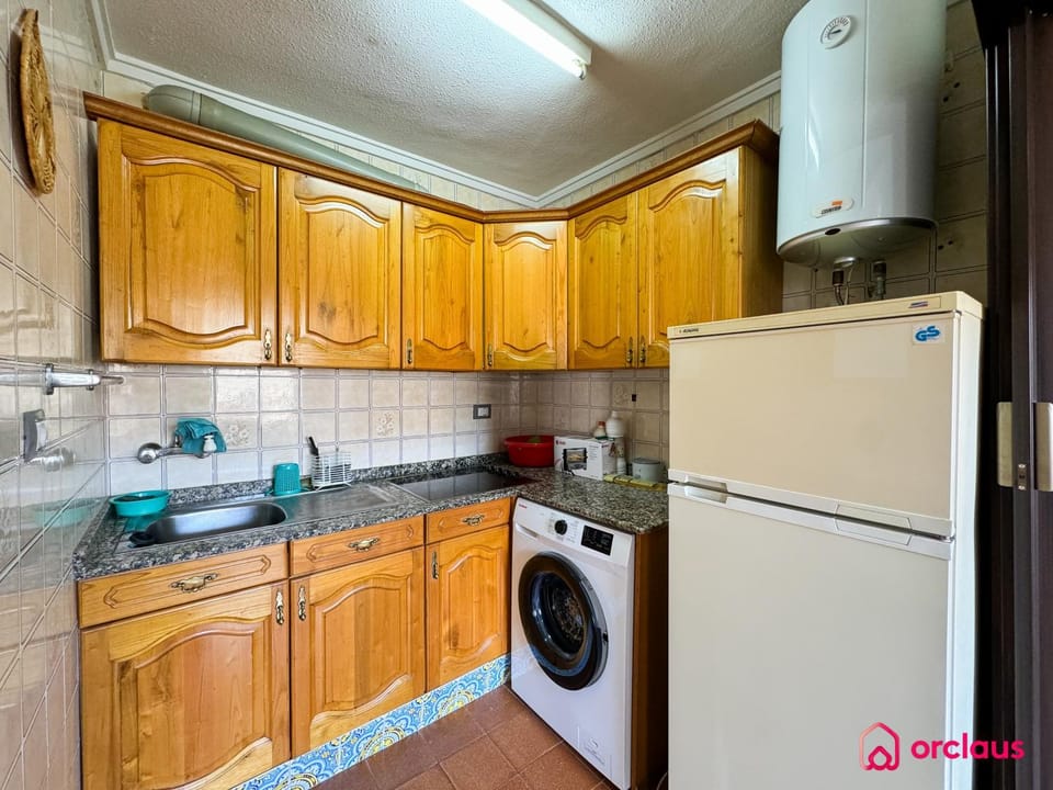 Kitchen or kitchenette, stove, washing machine
