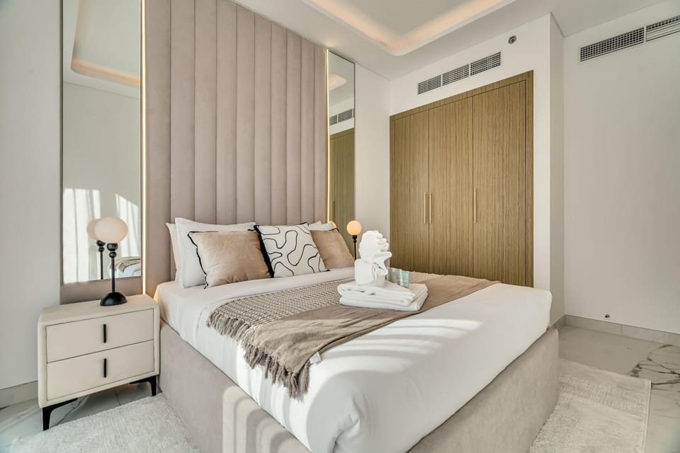 Bed, towels, wardrobe