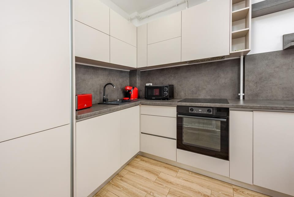 Kitchen or kitchenette, dishwasher, stove, toaster